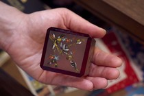 Picture of a person holding a paperweight