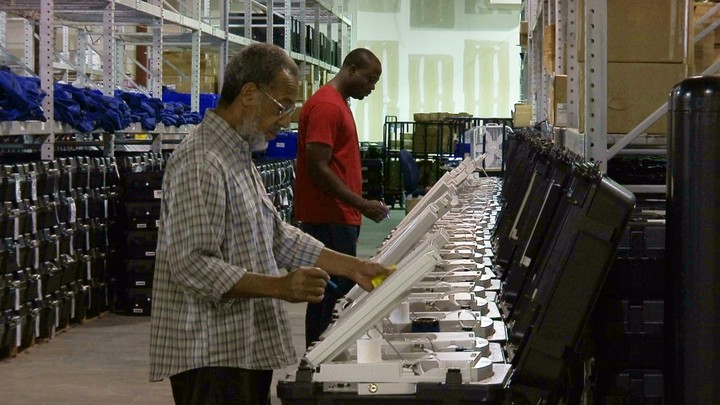 Voters use electronic voting machines.