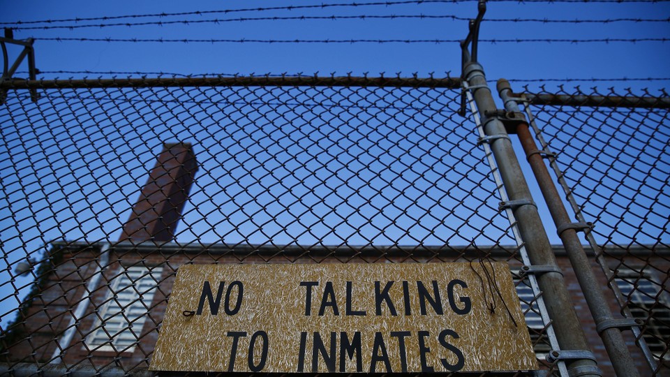 A jail with the sign "No Talking to Inmates"