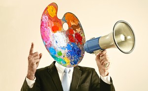 illustration of a man in a suit who has a paint palette for a head and is holding a megaphone