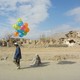 Boy selling balloons in Kabul in the early 1990's.