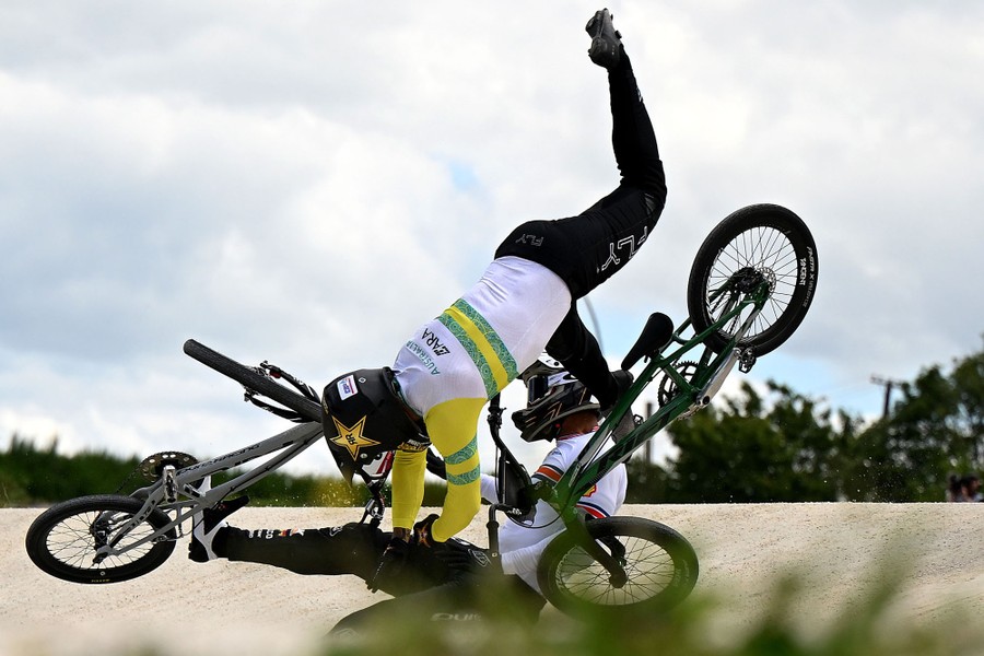 Two cyclists crash during a BMX race.