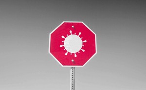 A coronavirus on a red stop sign