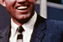 A close-up video of a man laughing