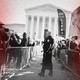 Police use metal barricades to keep protesters, demonstrators and activists apart in front of the U.S. Supreme Court