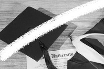 A photo-illustration featuring a graduation cap, gown, and diploma. A white line crosses through the middle