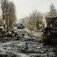 A  street strewn with destroyed tanks and debris