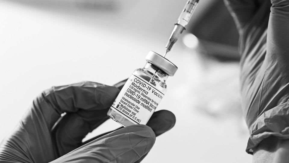 A picture of a vial of a COVID-19 vaccine