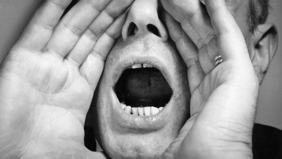 Person cupping their mouth to yell