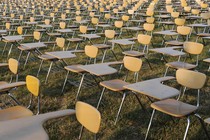 Empty desks fill the frame.