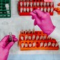 A lab technician tests blood samples.