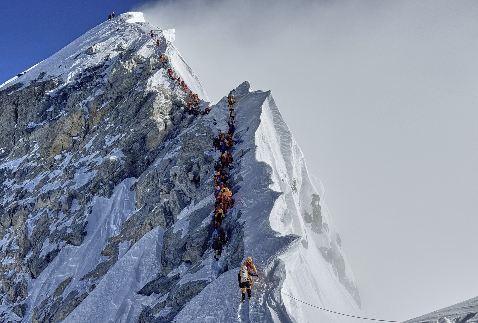 Mountaineers form a queue as they approach the summit of Mount Everest.