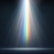 A rainbow-colored light shining down into a dark space