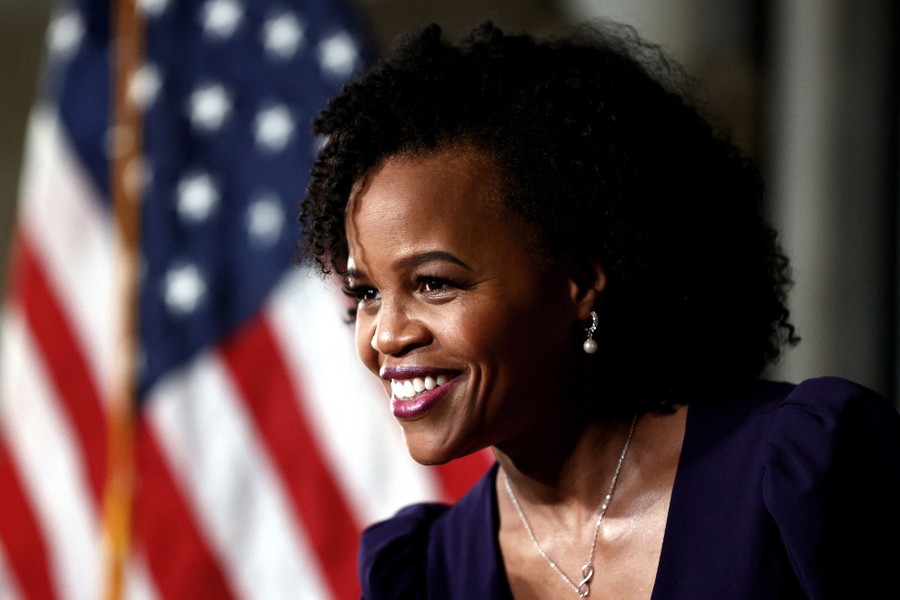 Boston Mayor Kim Janey is photographed in front of an American flag.