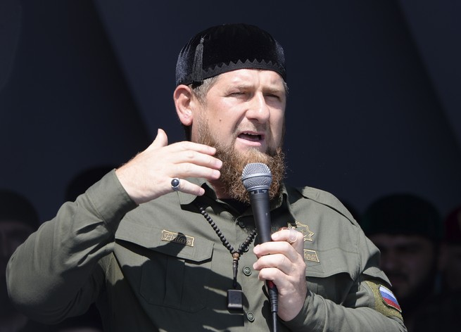 A photo of Ramzan Kadyrov speaking into a microphone.