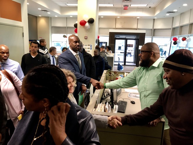 Abdul Malik (in green) greets participants of an October 2019 training hosted by the Credible Messenger Justice Center during their visit to a New York Probation Department building in the South Bronx.