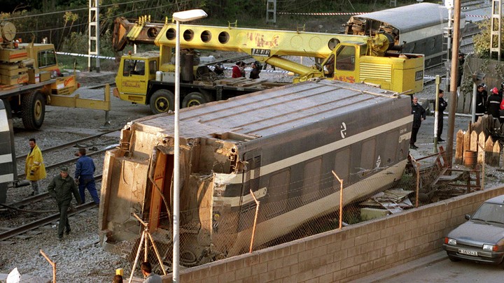 Workers clean up the wreckage of a train crash in Spain on September 9.