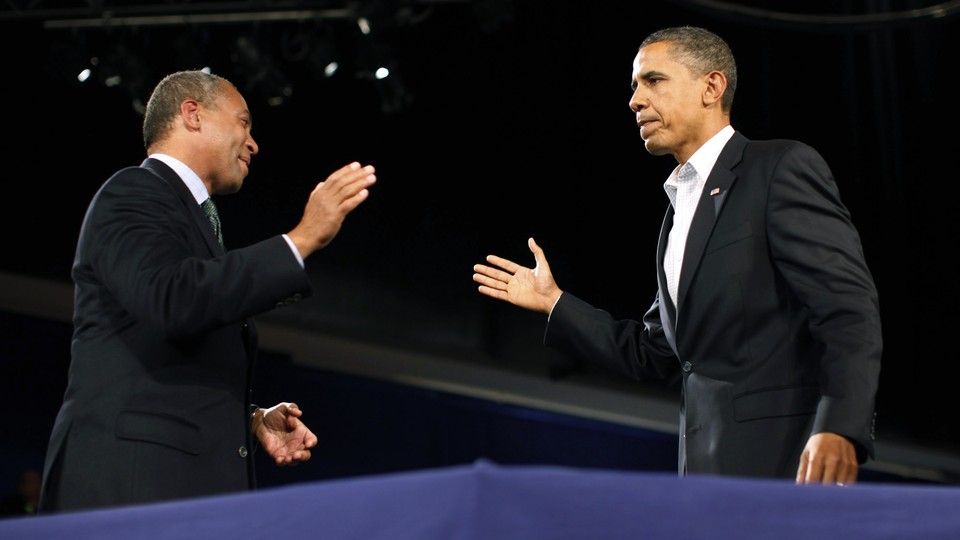 Deval Patrick and Barack Obama prepare to high-five.