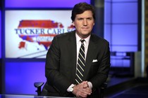 Tucker Carlson, host of "Tucker Carlson Tonight," looks at the camera.