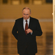 Vladimir Putin, entering through gold doors