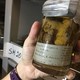 A jar containing preserved bloodworms taken from a zebra