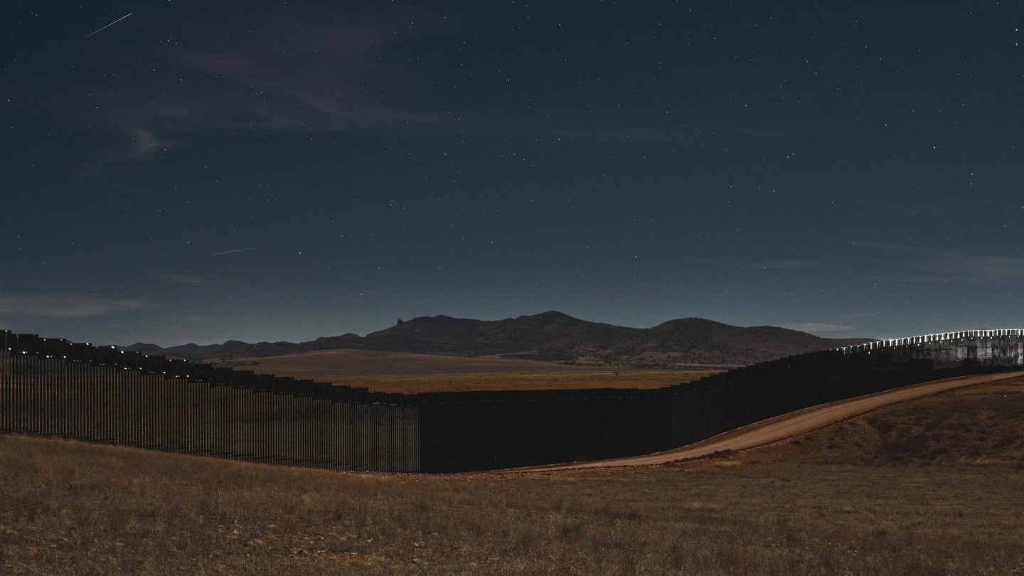 Border wall at night