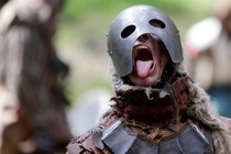 Participants dressed as dwarves, goblins, orcs, and other characters re-enact a battle from "The Hobbit," in a forest in the Czech Republic in 2016.
