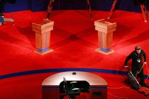 A photo of a red debate stage