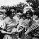 Millicent Brown smiling and talking with white classmates