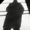 A man's shadow cast onto the floor