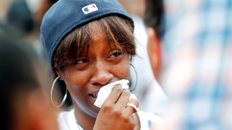 Diamond Reynolds, girlfriend of Philando Castile, weeps at a protest in St. Paul, Minnesota, on July 7, 2016. 