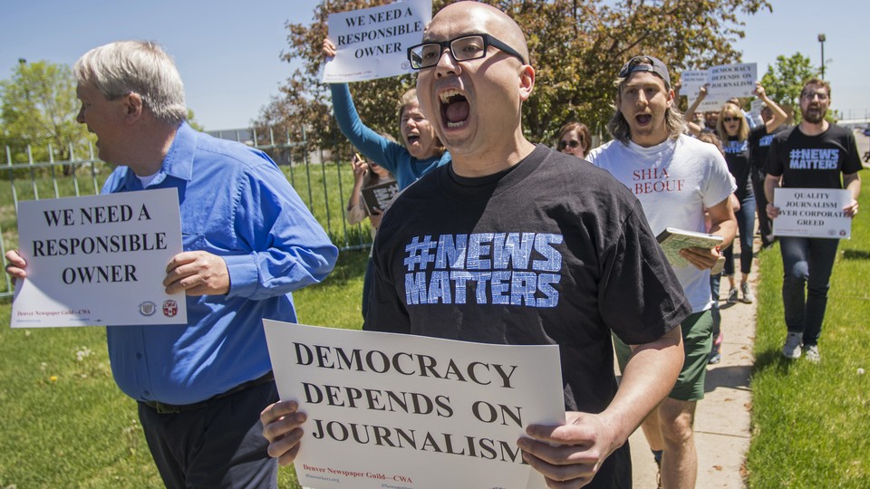 People protesting the ownership of The Denver Post