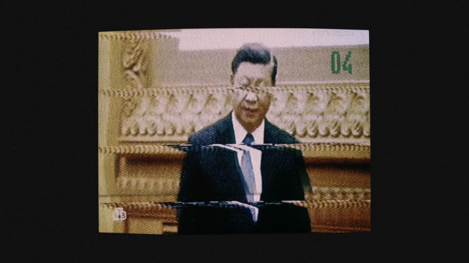 Chinese President Xi Jinping on a blurry television screen.