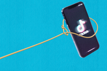 An illustration of a lasso catching a smartphone displaying the TikTok logo