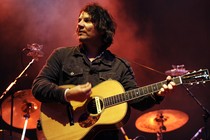 A photo of Jeff Tweedy performing