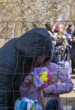 A man hugs a child.