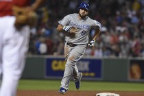 The Kansas City Royals third baseman Mike Moustakas (8) rounds the bases after hitting a three-run home run during the fourth inning against the Boston Red Sox at Fenway Park.