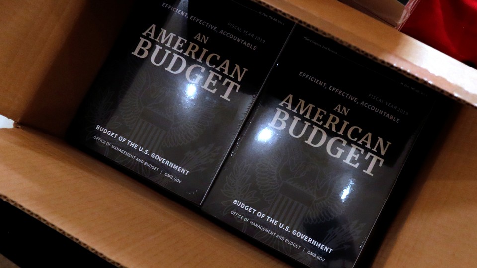 Copies of President Trump's fiscal 2019 budget proposal in a cardboard box