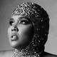 Black-and-white portrait of Lizzo in a sequined cap