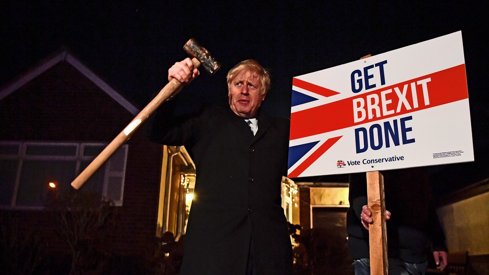 Boris Johnson with a sign reading "Get Brexit Done."