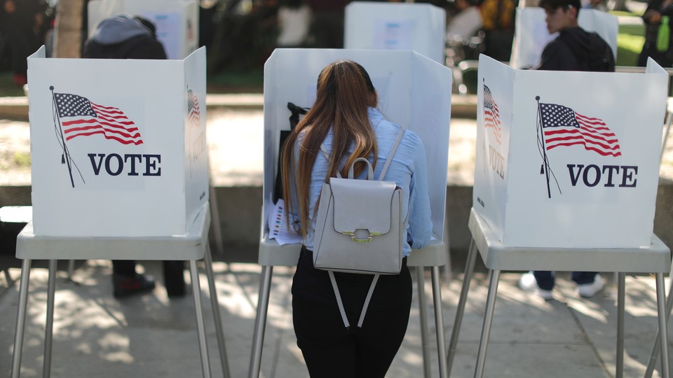A young woman votes.