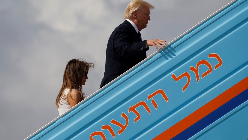 U.S. President Donald Trump and first lady Melania Trump board Air Force One to travel to Rome from Tel Aviv