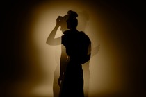 An image of a girl's silhouette in shadows 
