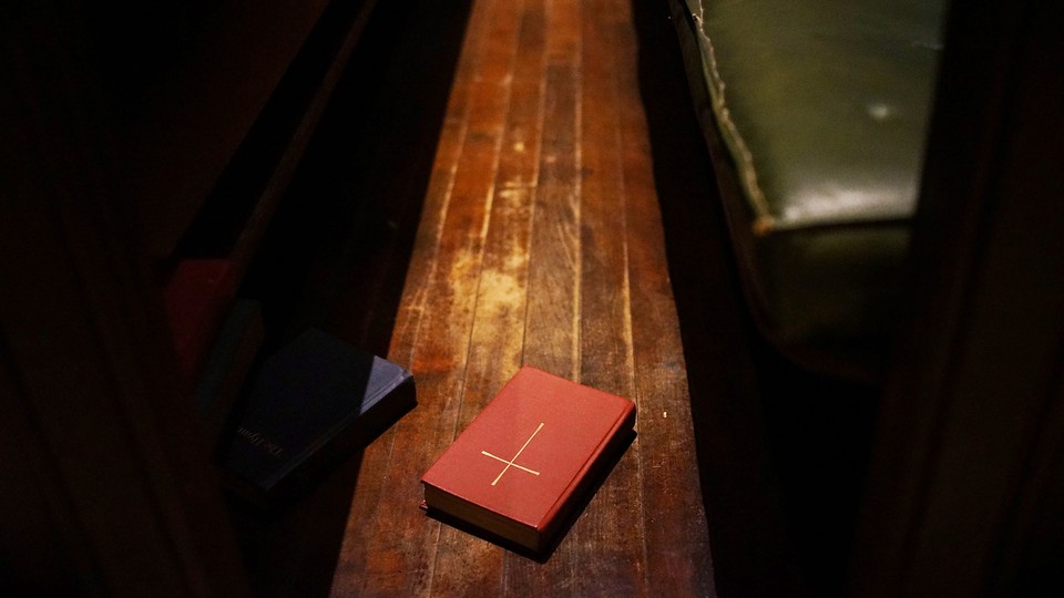 A bible on a pew.