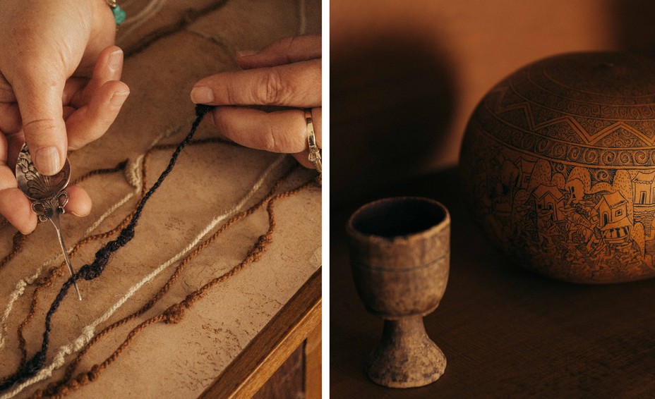 Close-up of a wine glass–shaped artifact in front of an oval-shaped vase decorated with hand-drawn designs. Both are Andean artifacts displayed on Hyland's shelf.