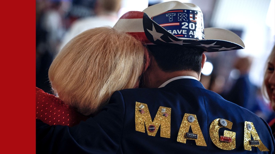 Photo showing woman resting her head on the shoulder of a man wearing "Trump 2024" cowboy hat and a jacket that reads MAGA