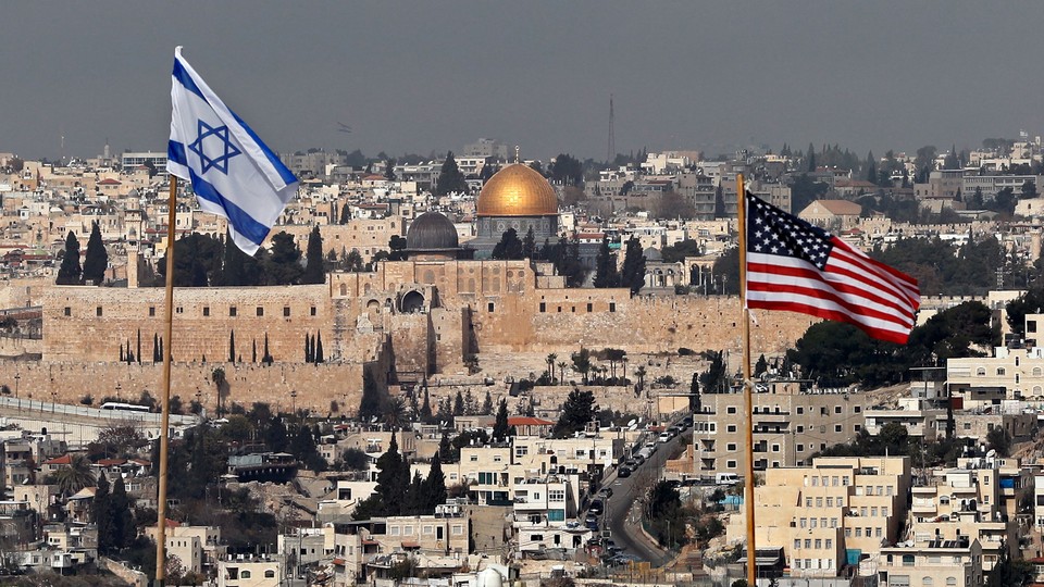 Israeli and American flags flying over Jerusalem