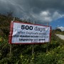 A sign reading "500 days after Daphne's murder, the masterminds still enjoy impunity and power" marks the location of Daphne Caruana Galizia's murder.