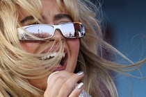 Sabrina Carpenter performs at Coachella and the crowd is reflected in her glasses