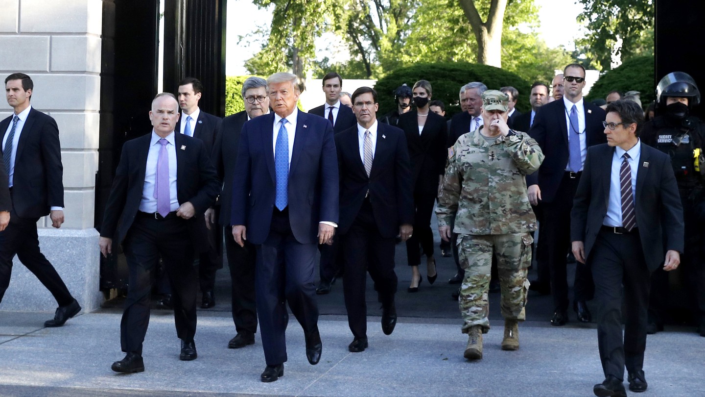 President Trump leads a group of aides on a now-infamous walk across Lafayette Square on June 1, 2020.